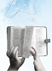 a person holding the Holy Bible over a rosary